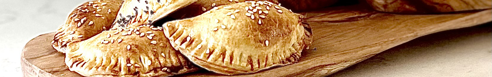 Argentinian Beef Empanadas on Olive Wood Board